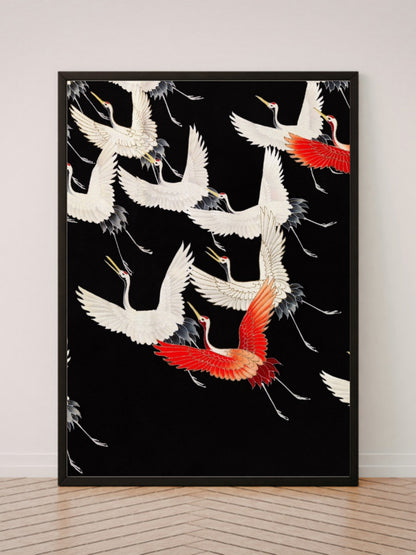 Furisode with a Myriad of Flying Cranes art print in a black frame, leaning against a white wall on a wood floor