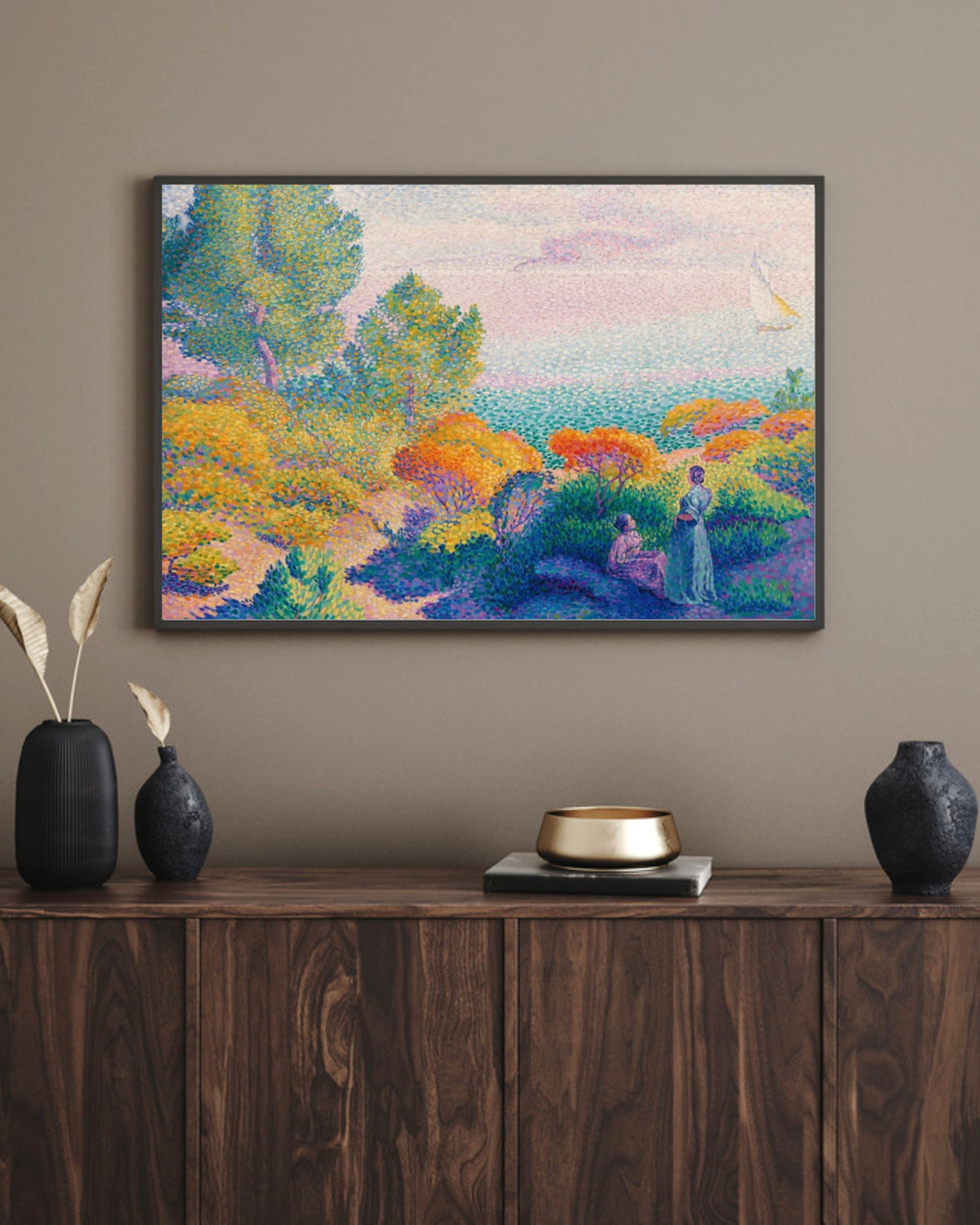 Two Women by the Shore art print in a black landscape frame above a walnut sideboard