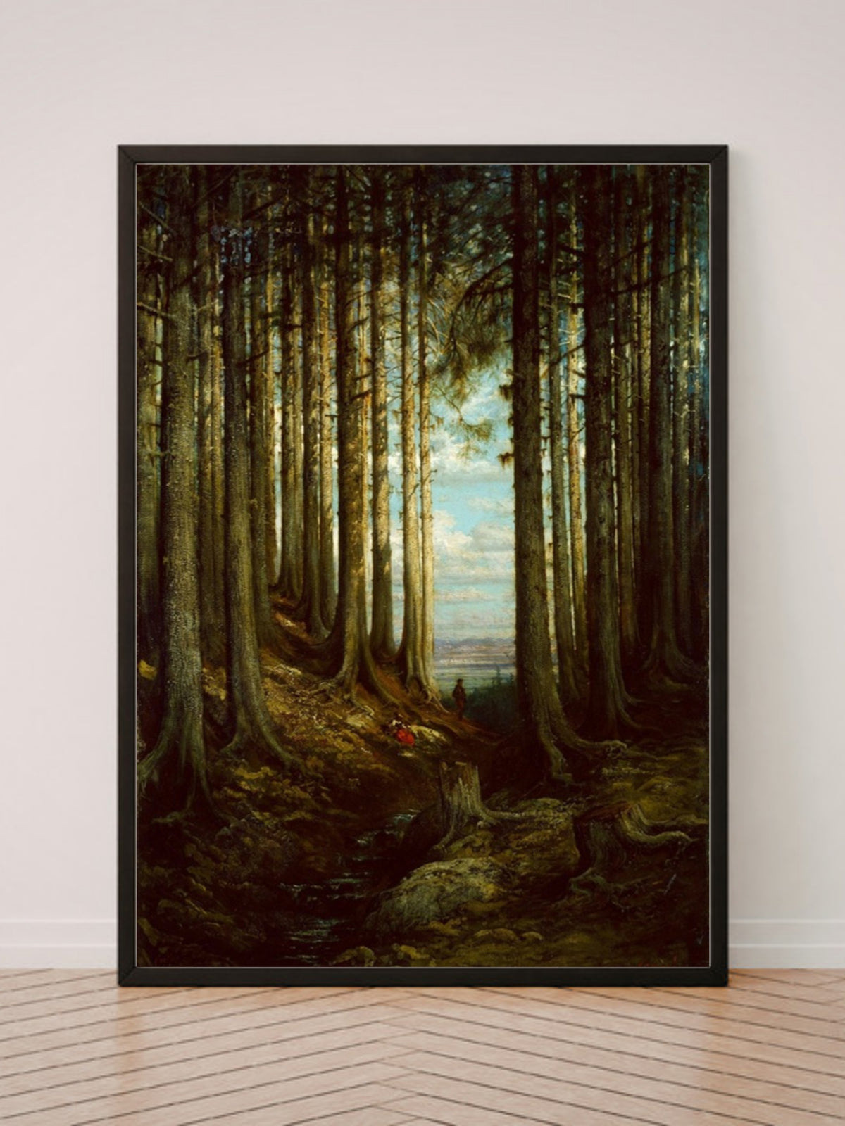 Alpine Scene art print in a black frame, leaning against a white wall on a wood floor