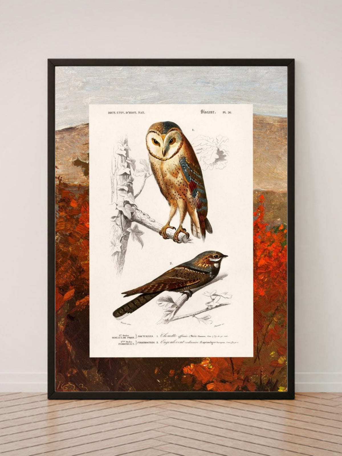 Birds and Autumn Treetops art print in a black frame, leaning against a white wall on a wood floor