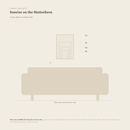 Size guide for Sunrise on the Matterhorn: all 4 print sizes from A5 to A2, drawn to true scale against a three-seat sofa 84 inches wide.